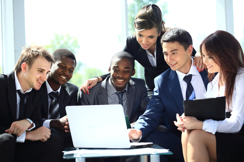 Happy working business team in modern office