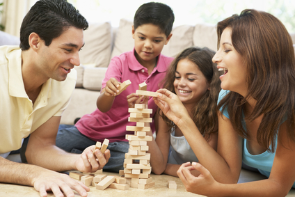 Family Playing Game Together At Home